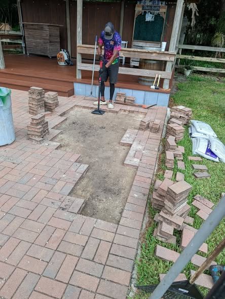 The paver base being levelled and screeded flat before relaying